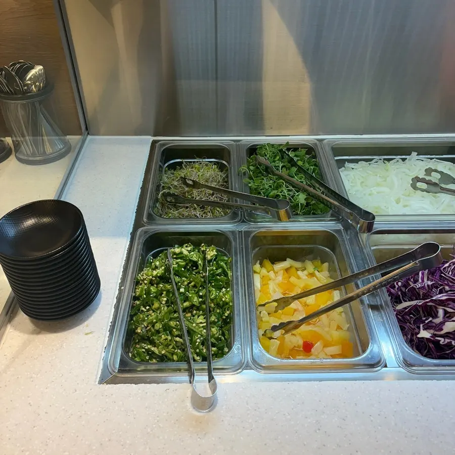 Self-serve salad bar vegetable station at Pyeonbaek Hoegwan