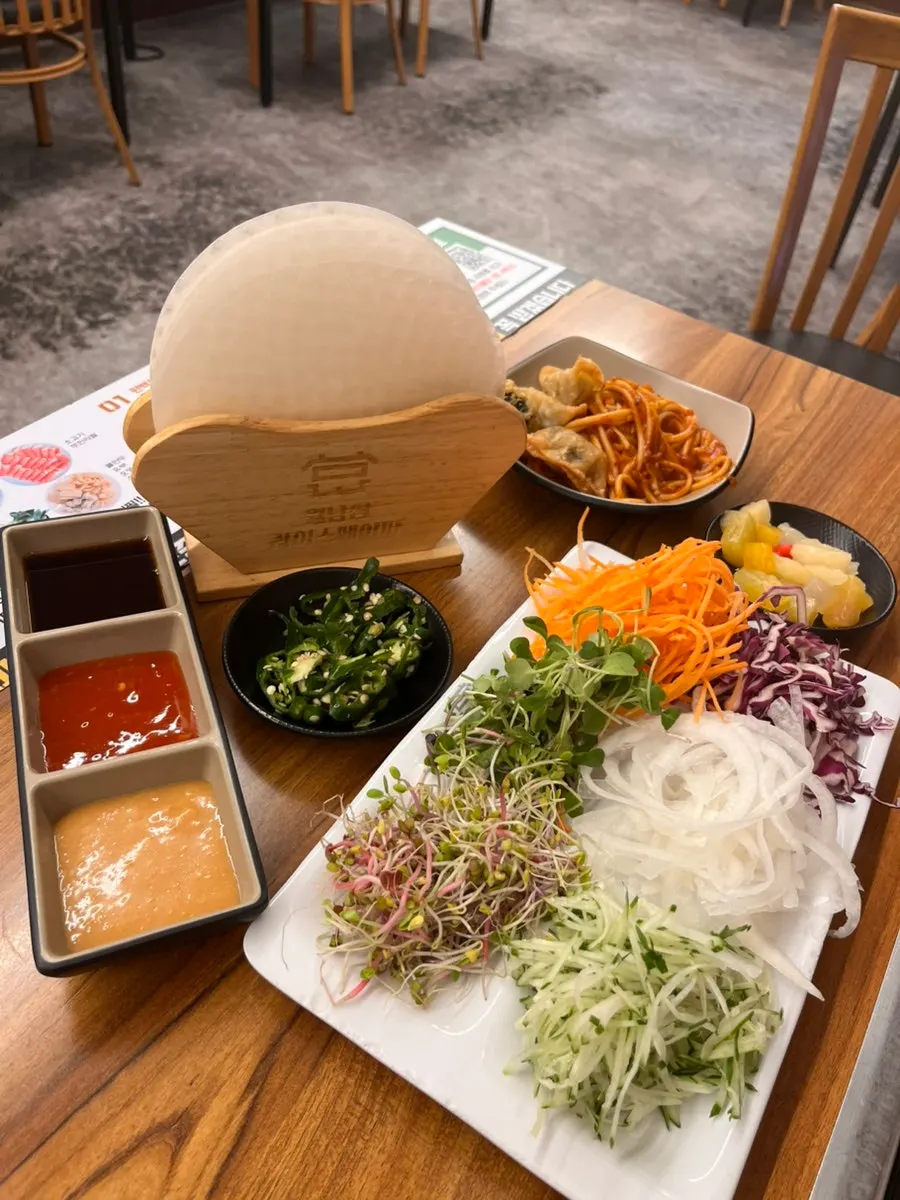 Appetizer corner with tteokbokki, fries, and more