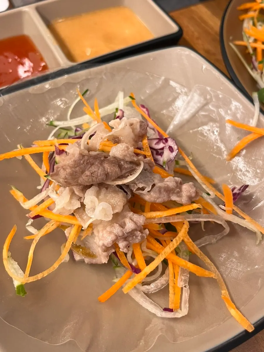 Meat and vegetables placed on a rice paper wrapper