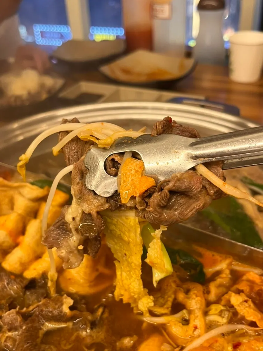 Vegetables and meat added to boiling broth