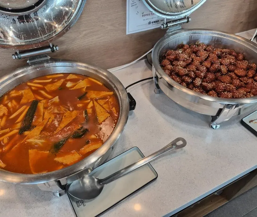 Salad bar corner with japchae and tteokbokki