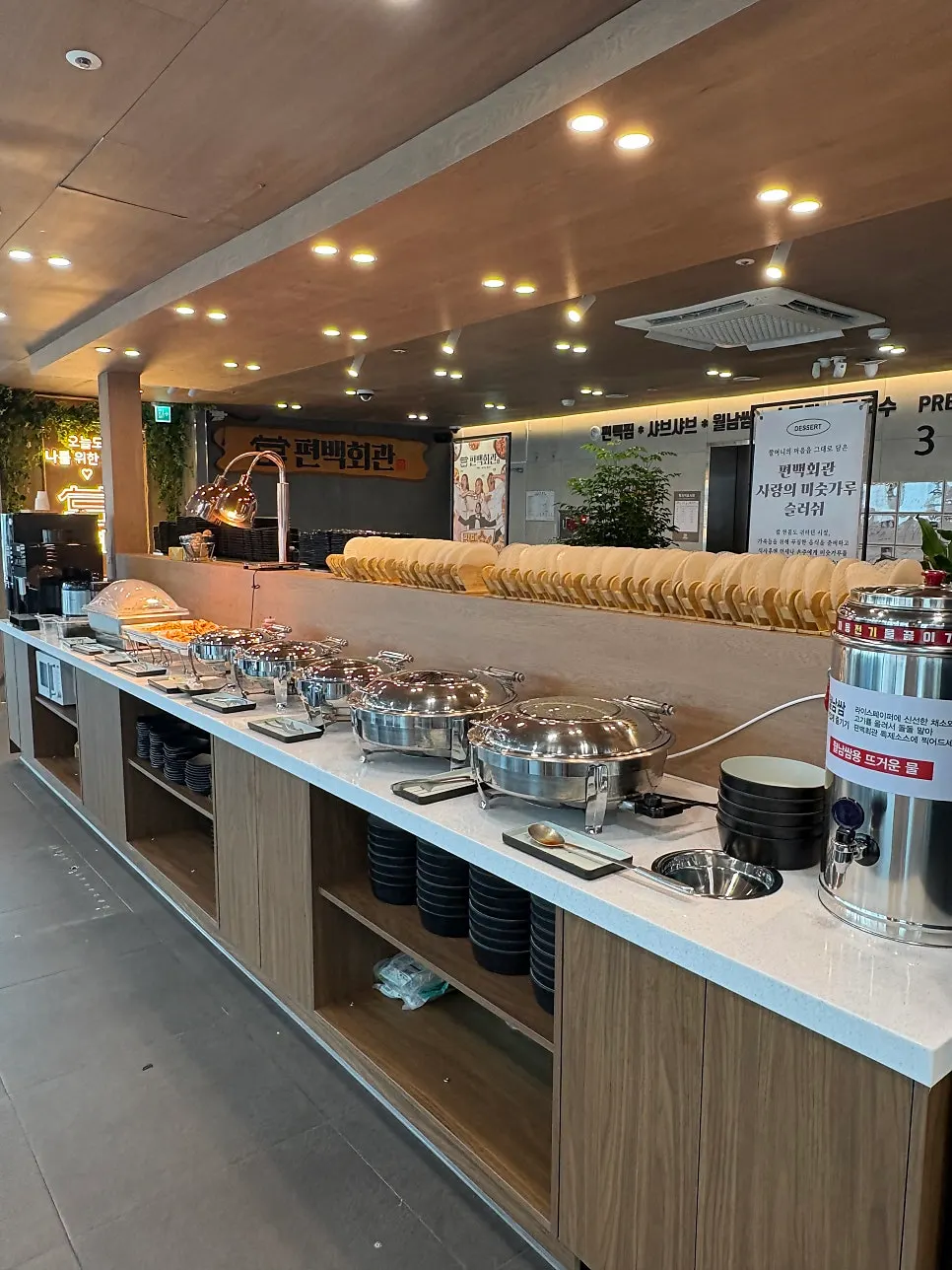 Neatly arranged salad bar under bright lighting