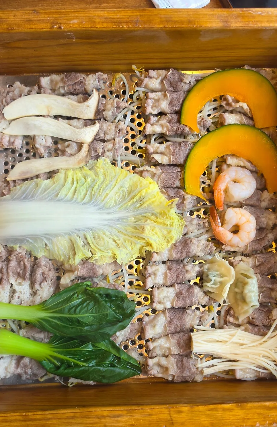 Rice-paper roll ingredients and buffet items gathered from the salad bar