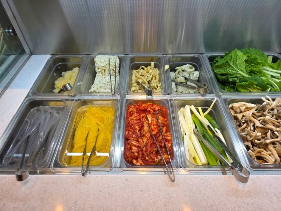 Self-serve bar with vegetables for shabu-shabu