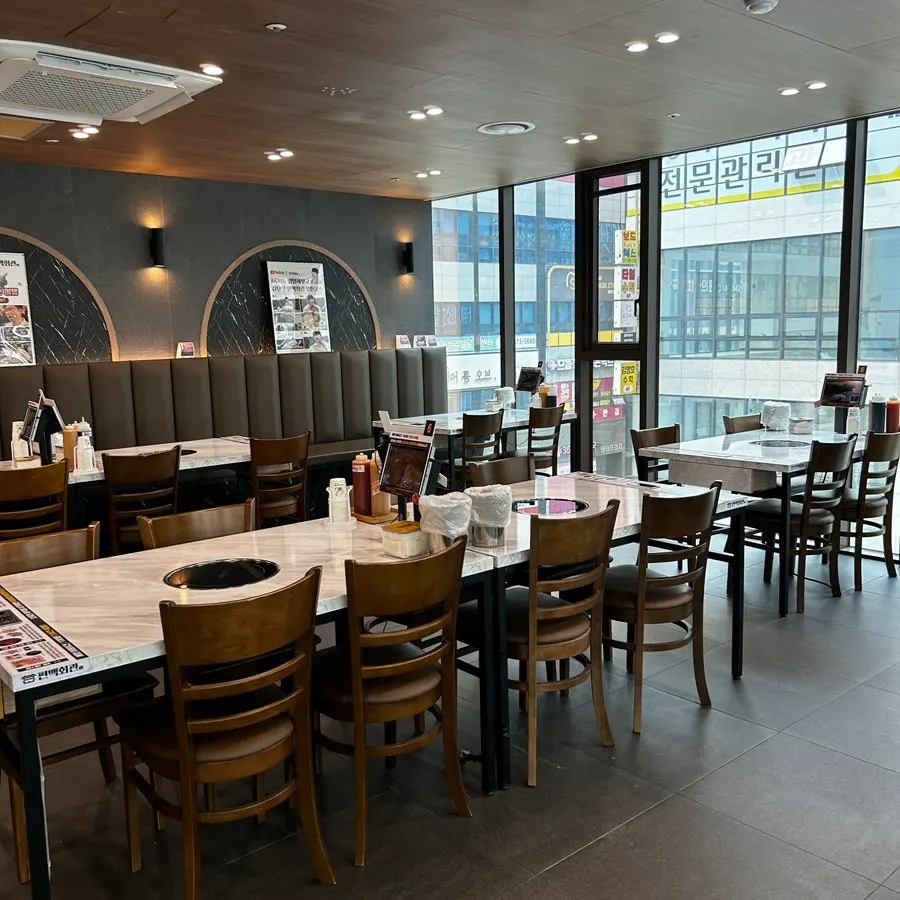 Renovated interior seating at Pyeonbaek Hoegwan Siheung Janggok Branch