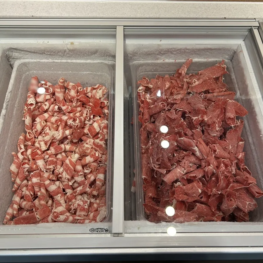 Self-serve bar of shabu-shabu and spring roll vegetables