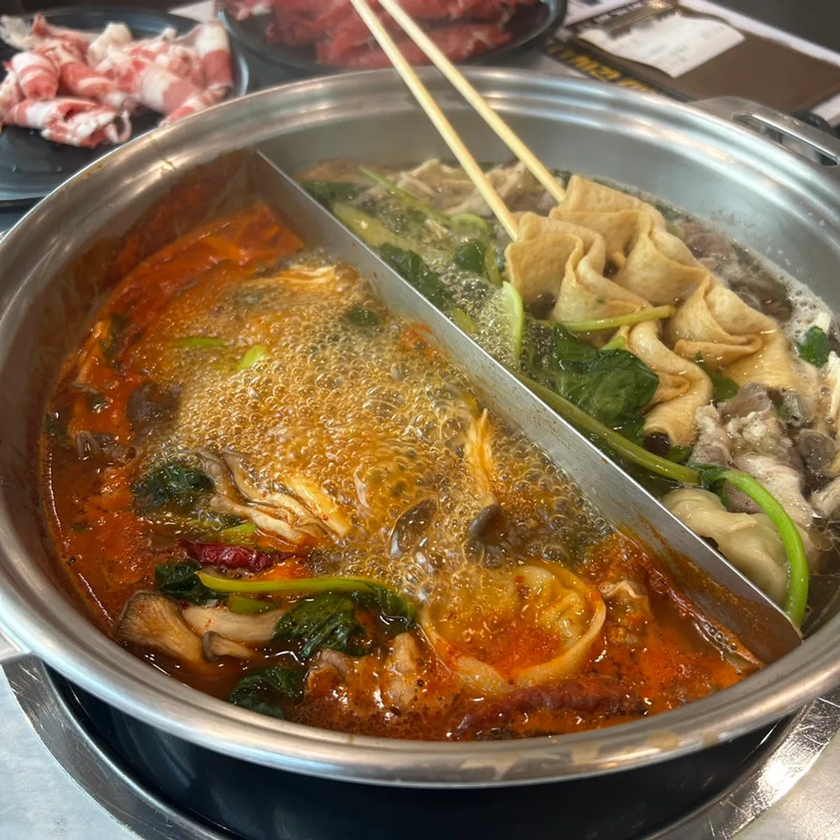 Shabu-shabu with vegetables and beef simmering in the broth