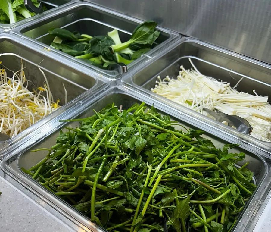 Half-and-half broth pot starting to boil