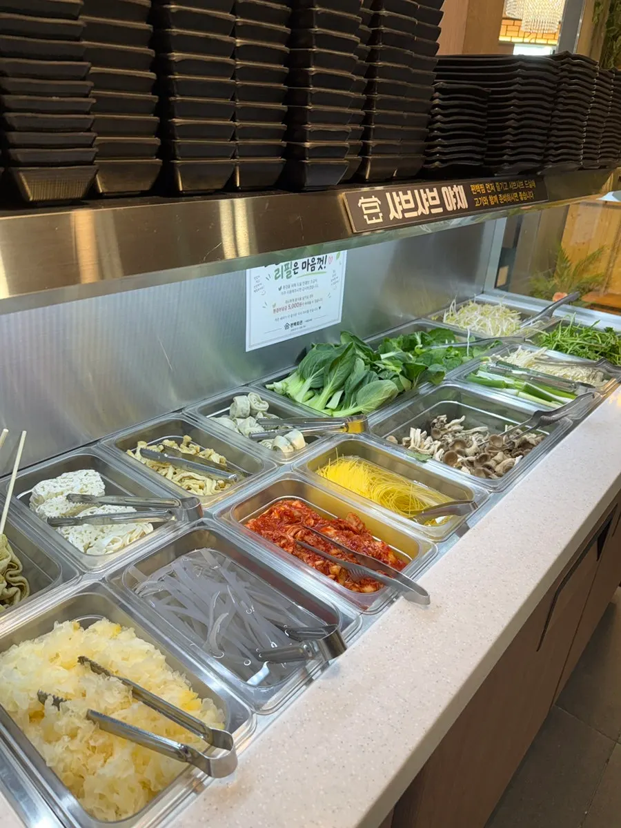 Self-serve bar corner with meat and broth