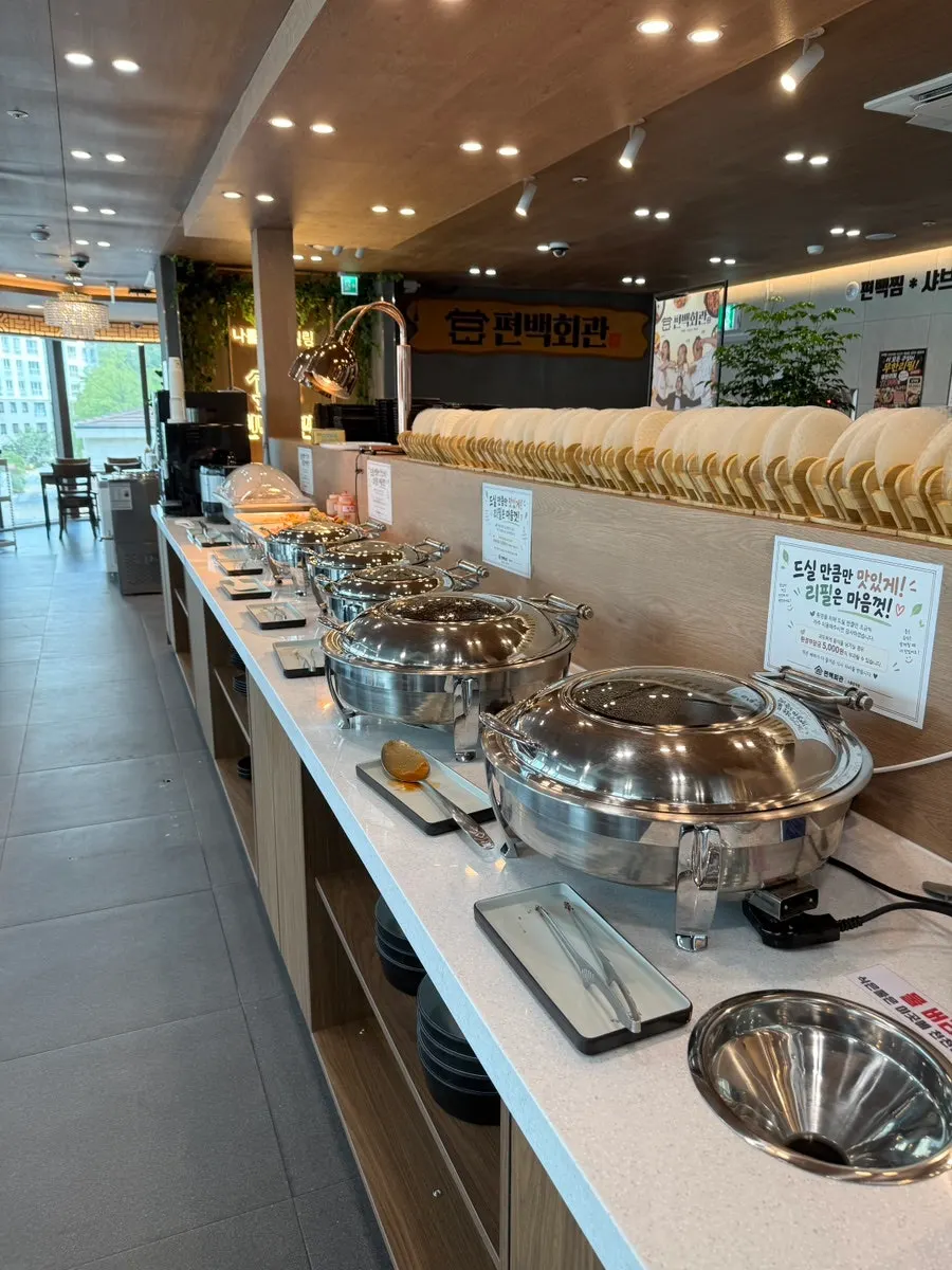Tableware neatly organized to one side with event signage