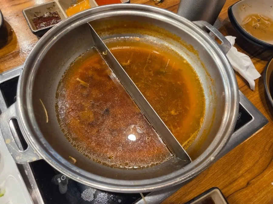Two-person dinner table set with cypress steam and shabu-shabu