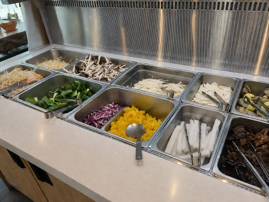 Self-serve bar with rice-paper roll and shabu-shabu ingredients