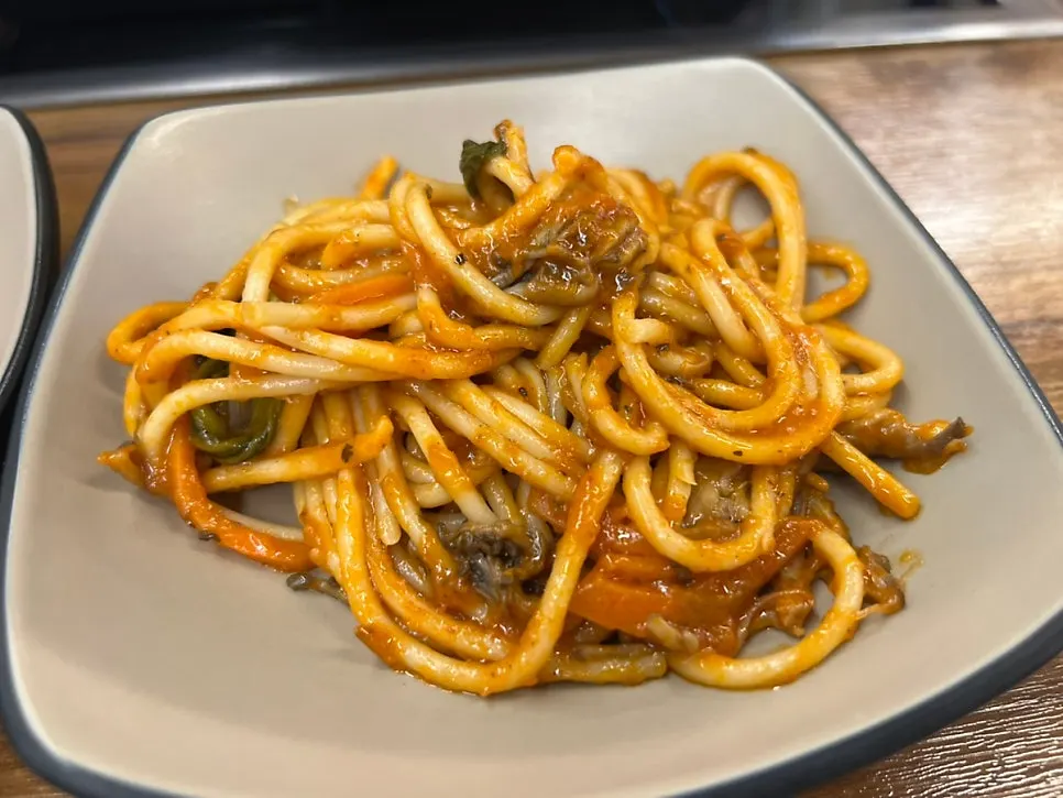 A plate brought back with pasta and tteokbokki