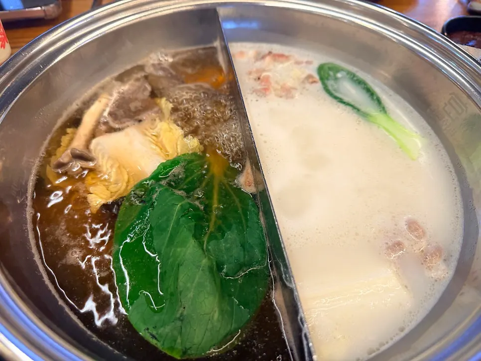 Plate piled high with meat and vegetables for shabu-shabu