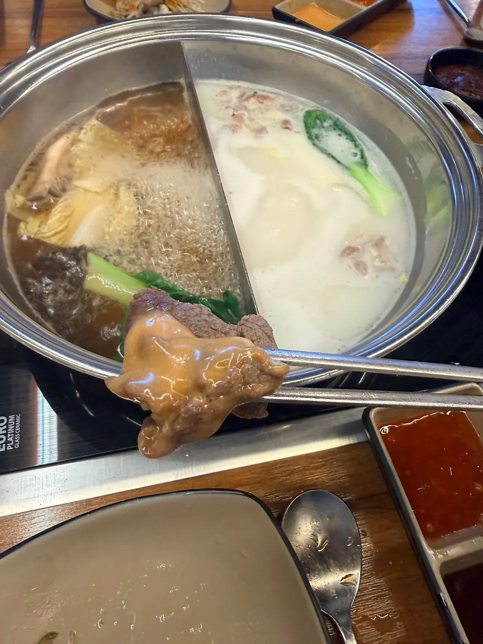 Ingredients cooking in the shabu-shabu broth