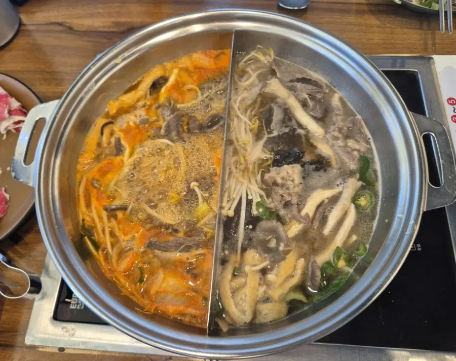 Beef and vegetables added to the shabu-shabu pot
