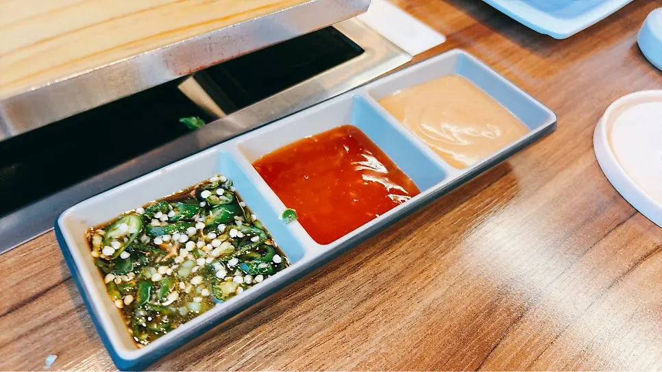Chili sauce, peanut sauce, and ponzu sauce trio