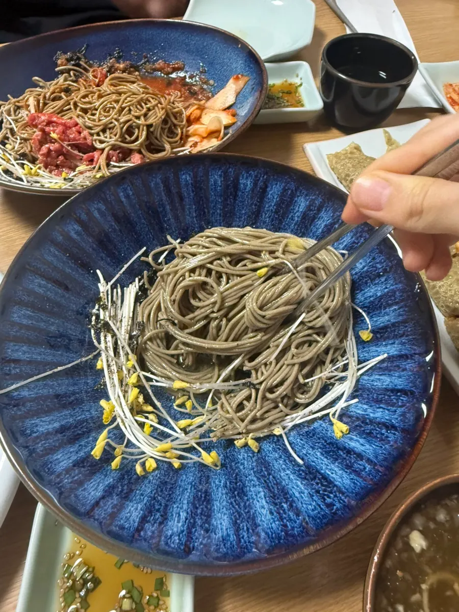 Buckwheat noodles lifted from the migamyeon bowl