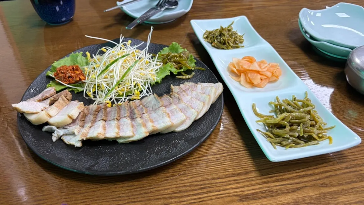 Table spread of buckwheat sprout pork belly