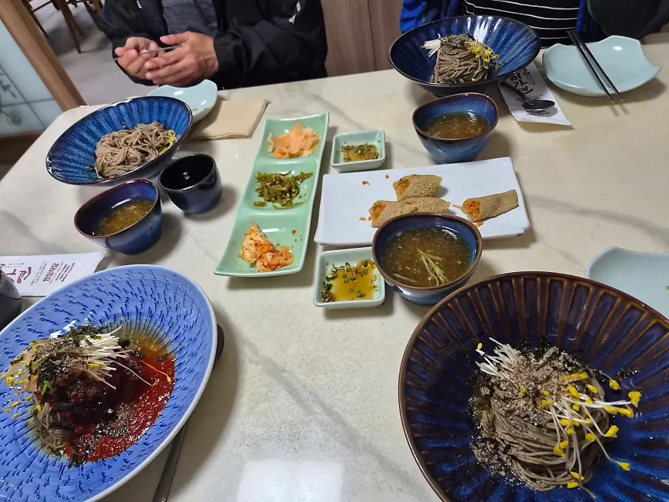 Table spread with migamyeon and bibim noodles