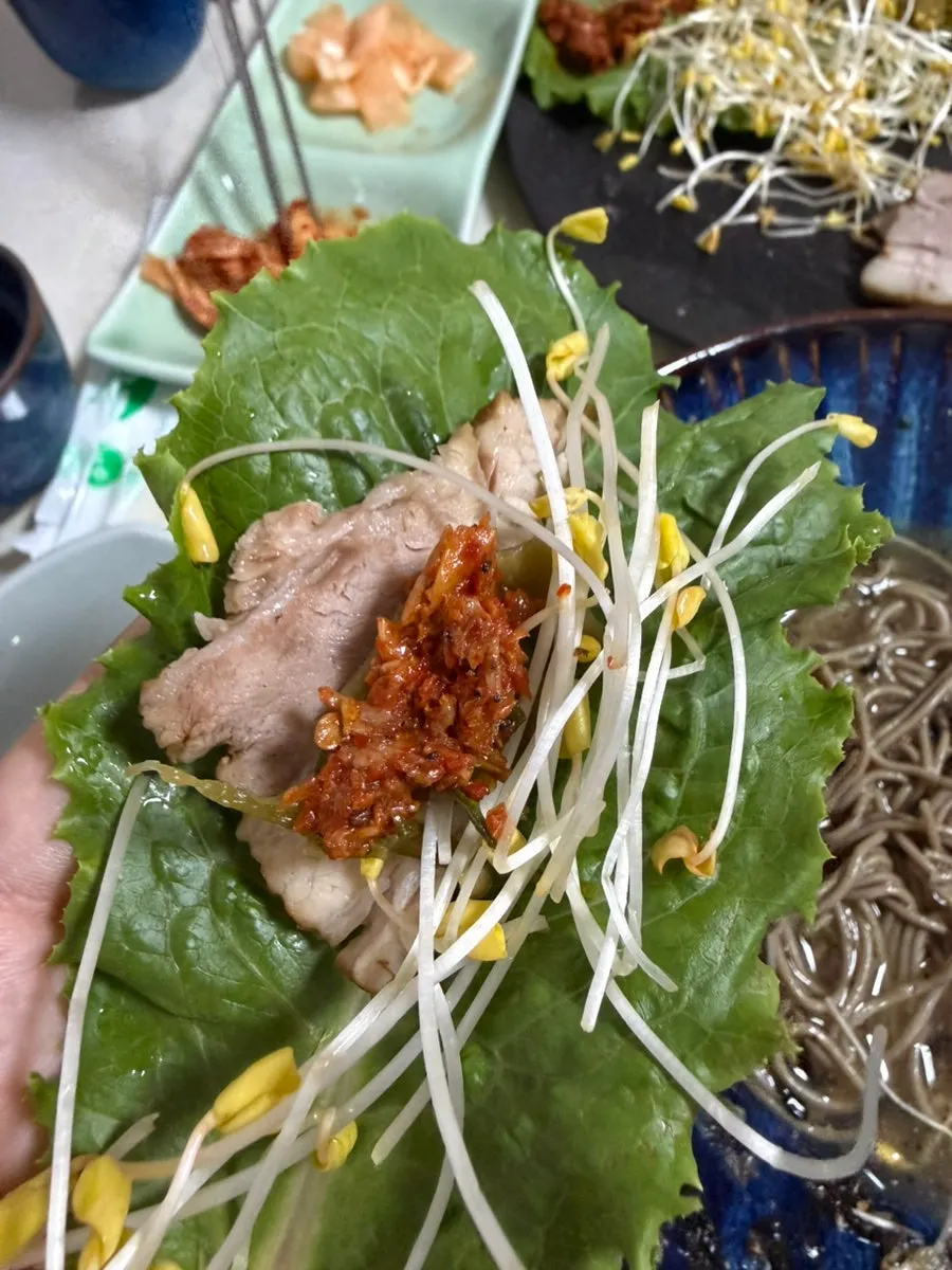Buckwheat sprouts served alongside the boiled pork
