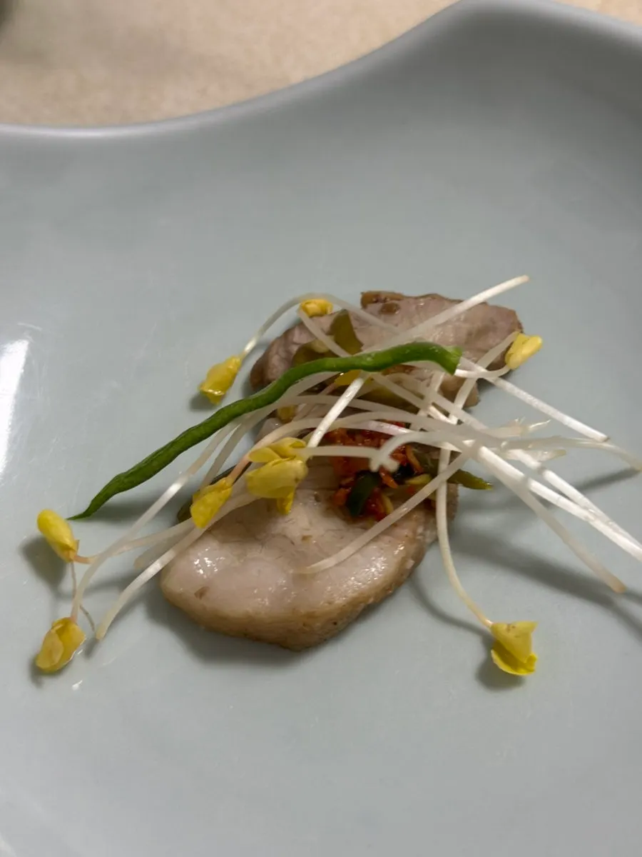 Table setting with boiled pork and homemade ssamjang