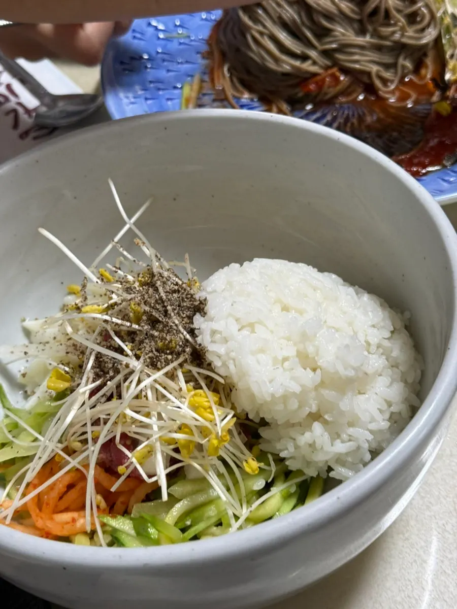 Deulgireum makguksu with the chilled broth on the side