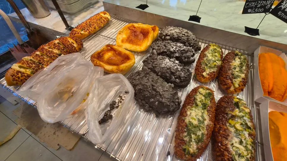 Display of croquettes, garlic bread, and pollock roe baguettes