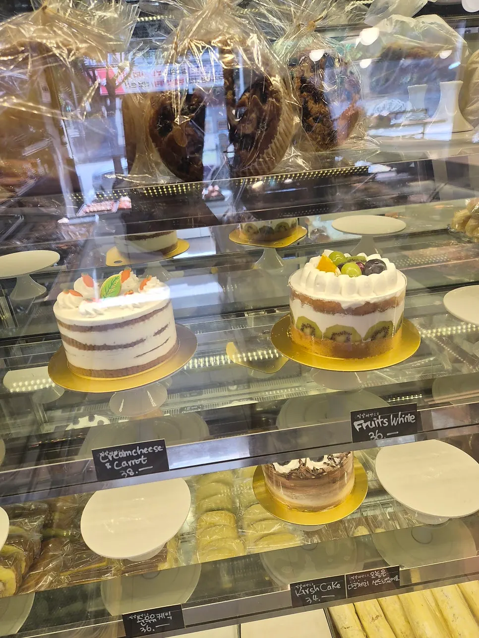 Showcase with fresh milk cream cake