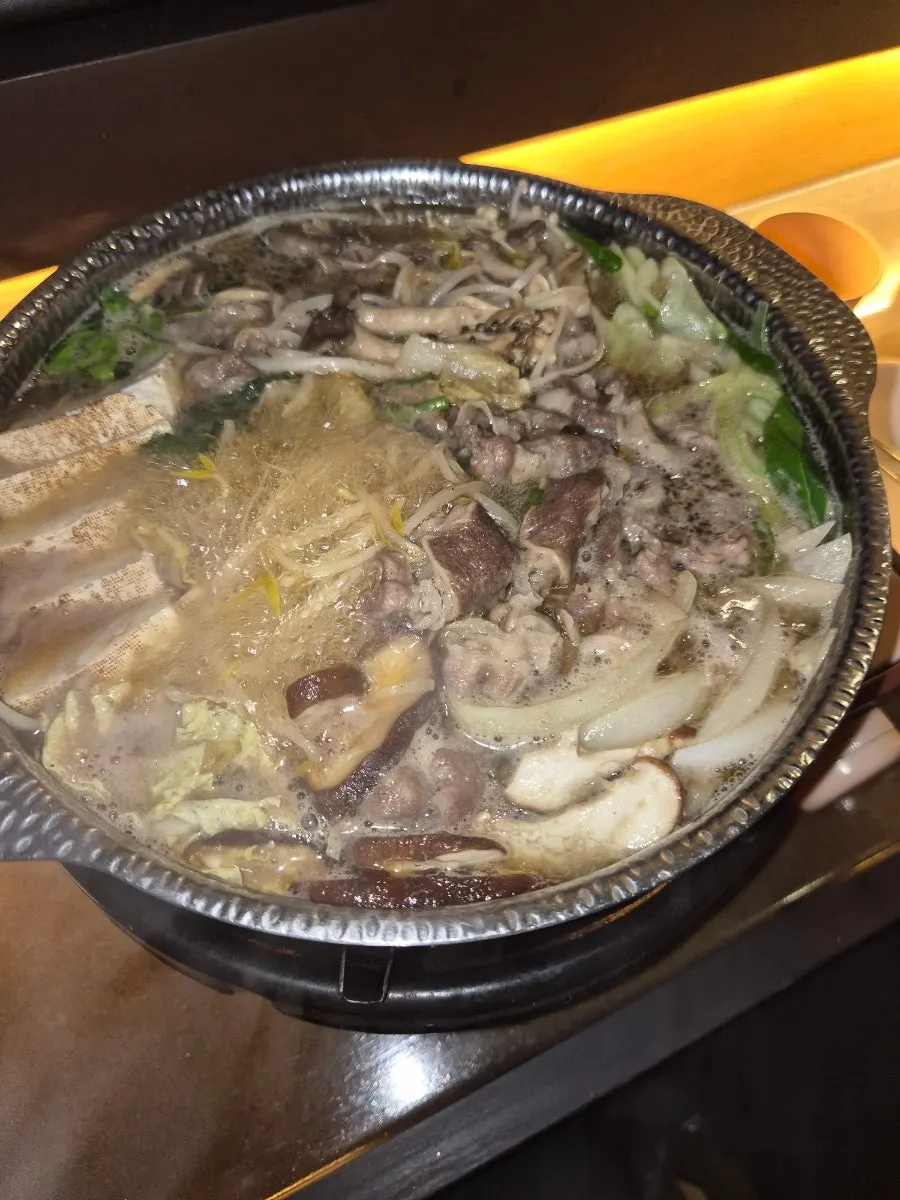 Sukiyaki broth bubbling away
