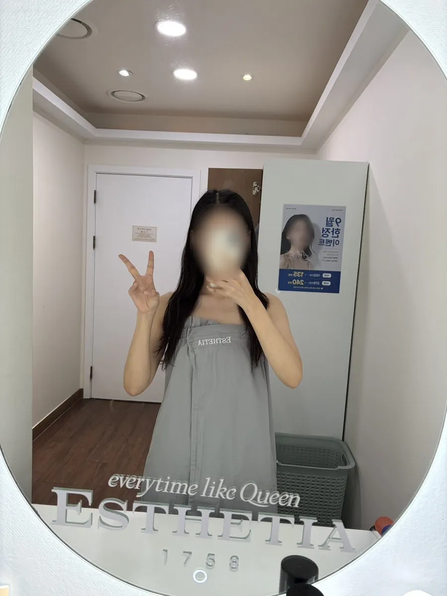 Powder room with a hair dryer and hairspray