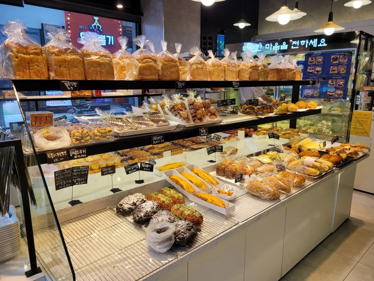 Bread display shelves inside Milbat Bakery Pyeongchon