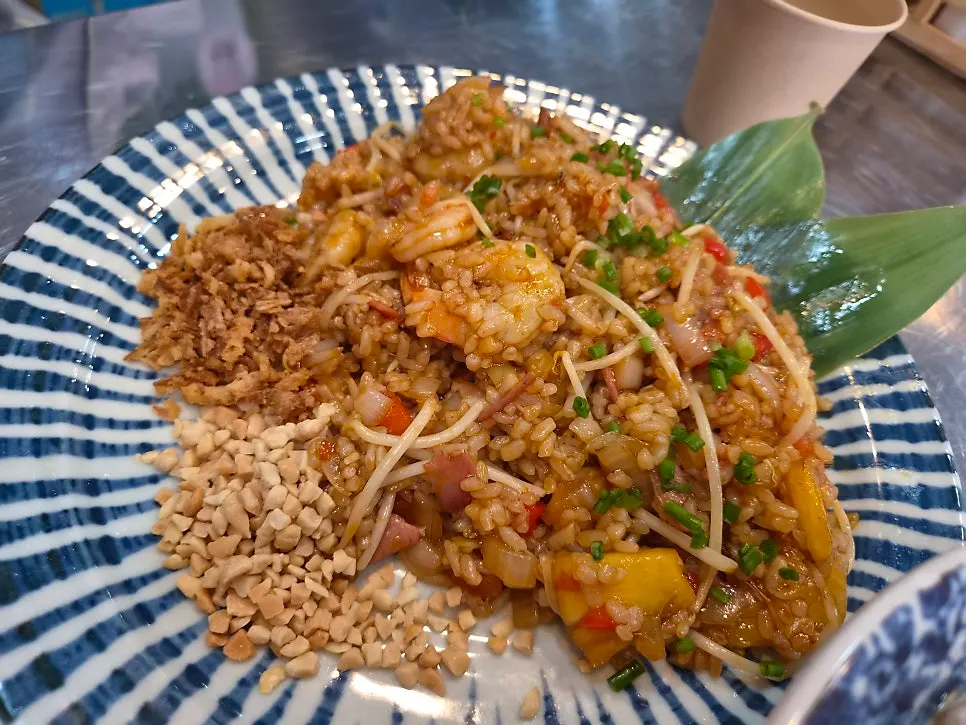 Lifting up the pho noodles and meat