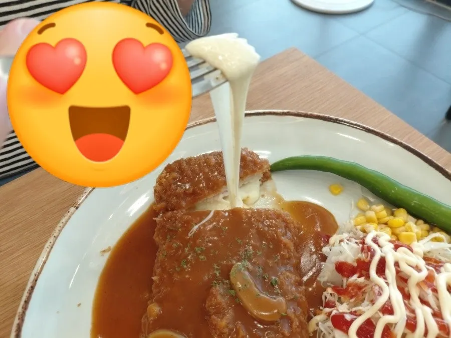 Cheese stretching from the cheese waterfall donkatsu