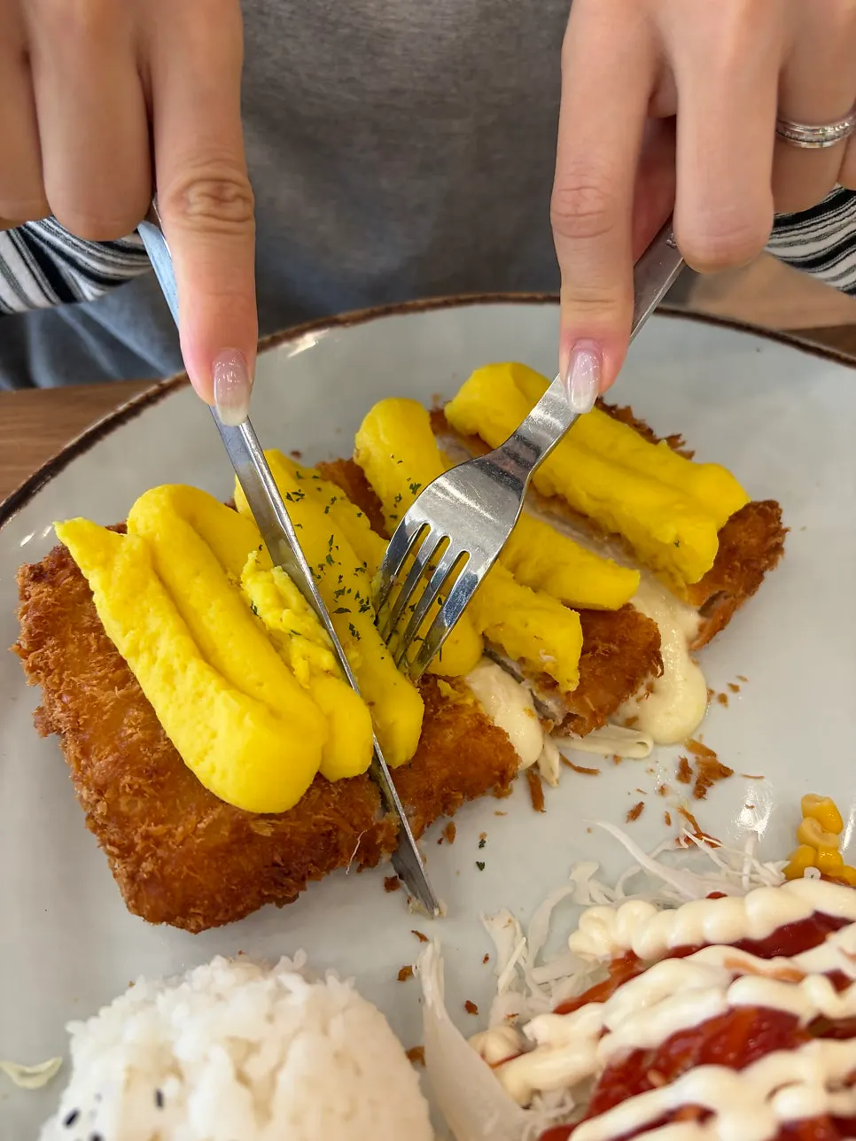 A plate of sweet potato cheese donkatsu