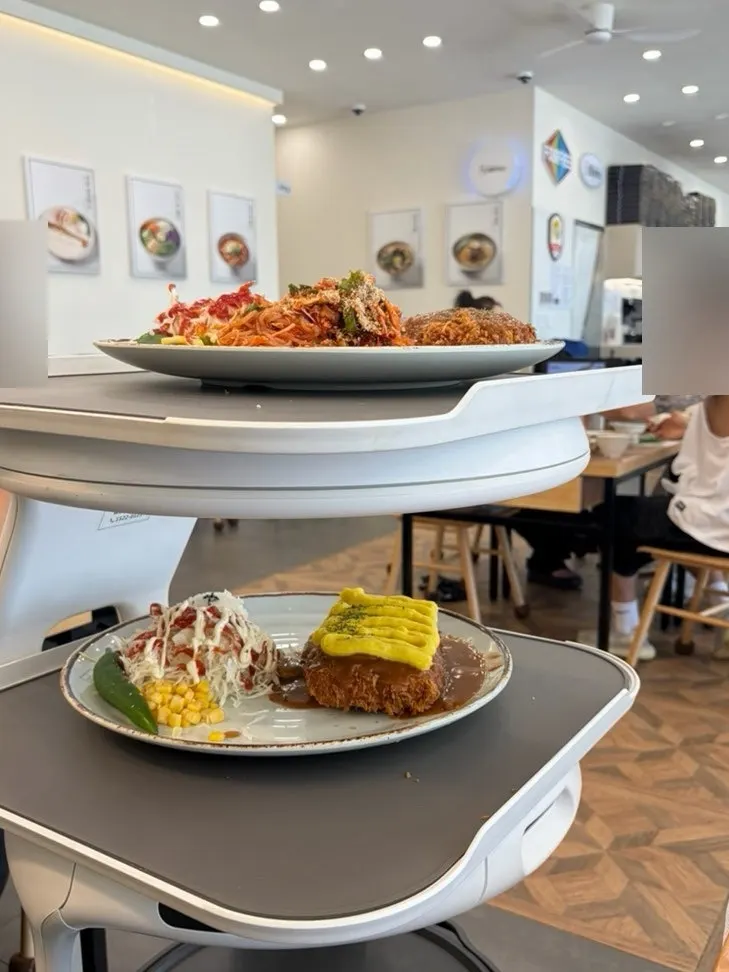 Serving robot carrying food