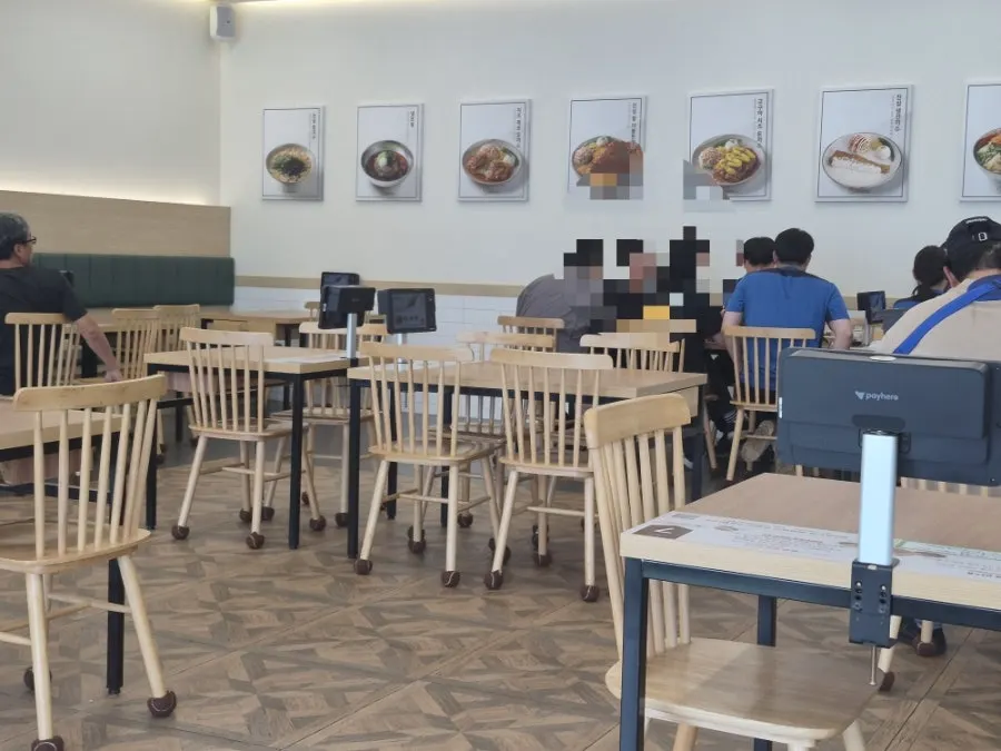 Spacious dining hall with herringbone tile floor