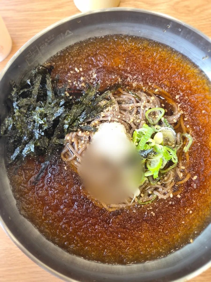 Cold soba served in a stainless steel bowl