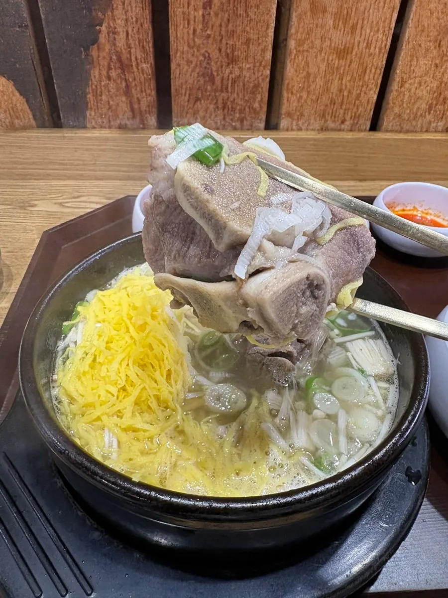 Bone kalguksu and bone soup rice served side by side