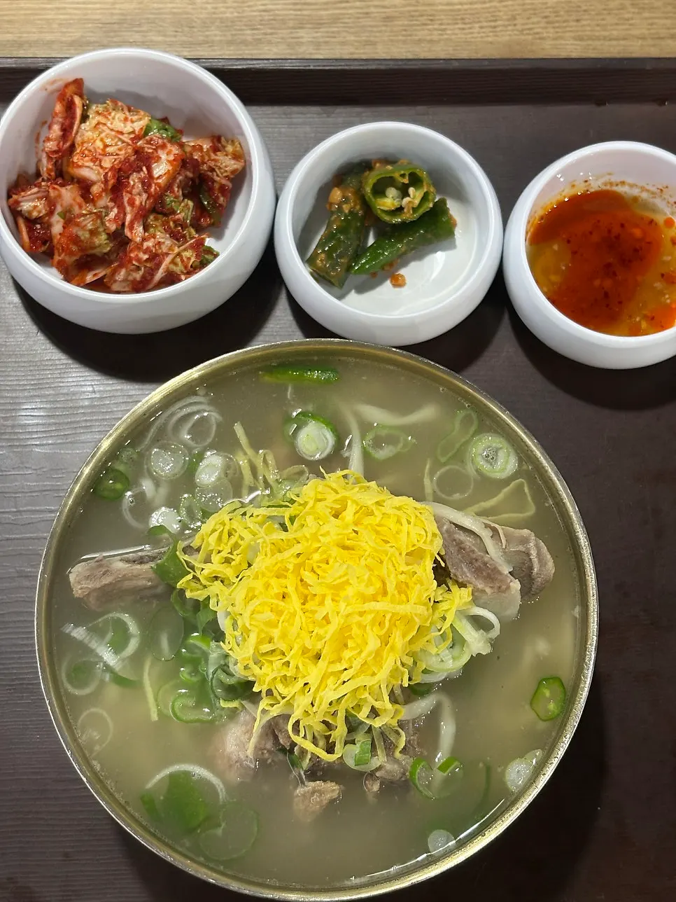 A bowl of single bone kalguksu topped with grilled bone meat