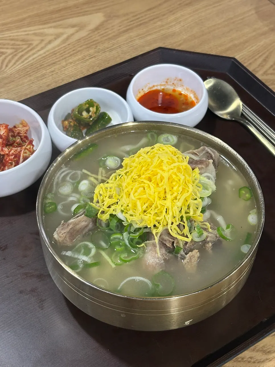 Bone kalguksu topped with plenty of egg garnish