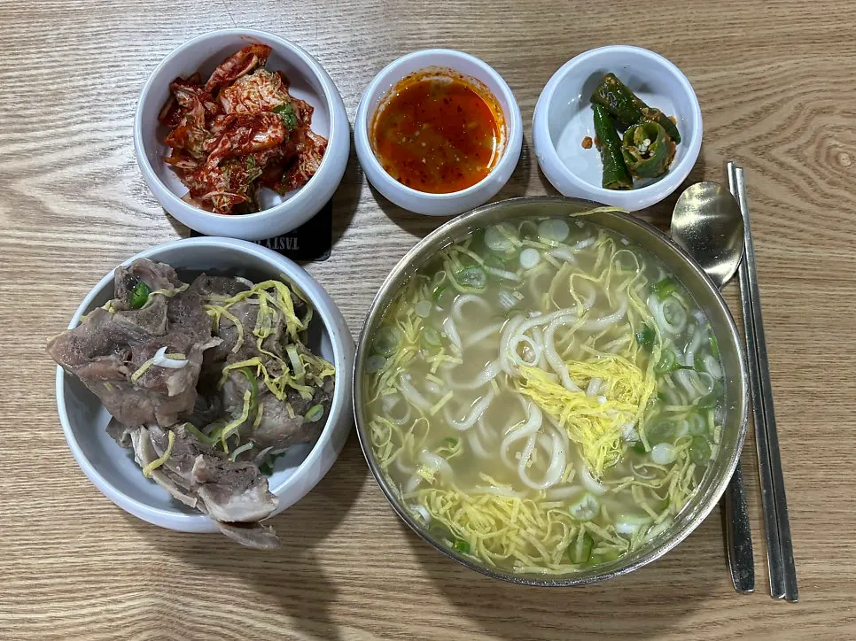 A spoonful of bone kalguksu broth