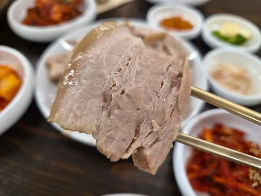 A thickly sliced piece of bossam pork