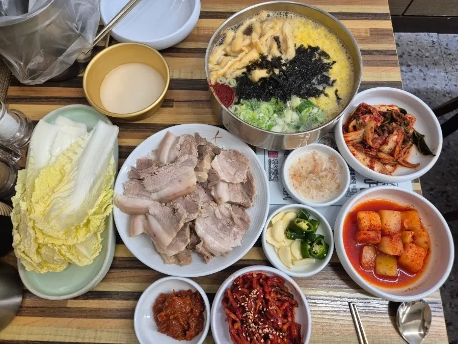 Table set with bossam and side dishes