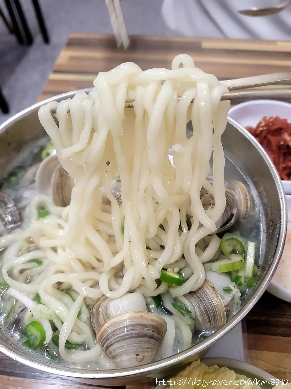 Small bowl portioned out with broth and noodles