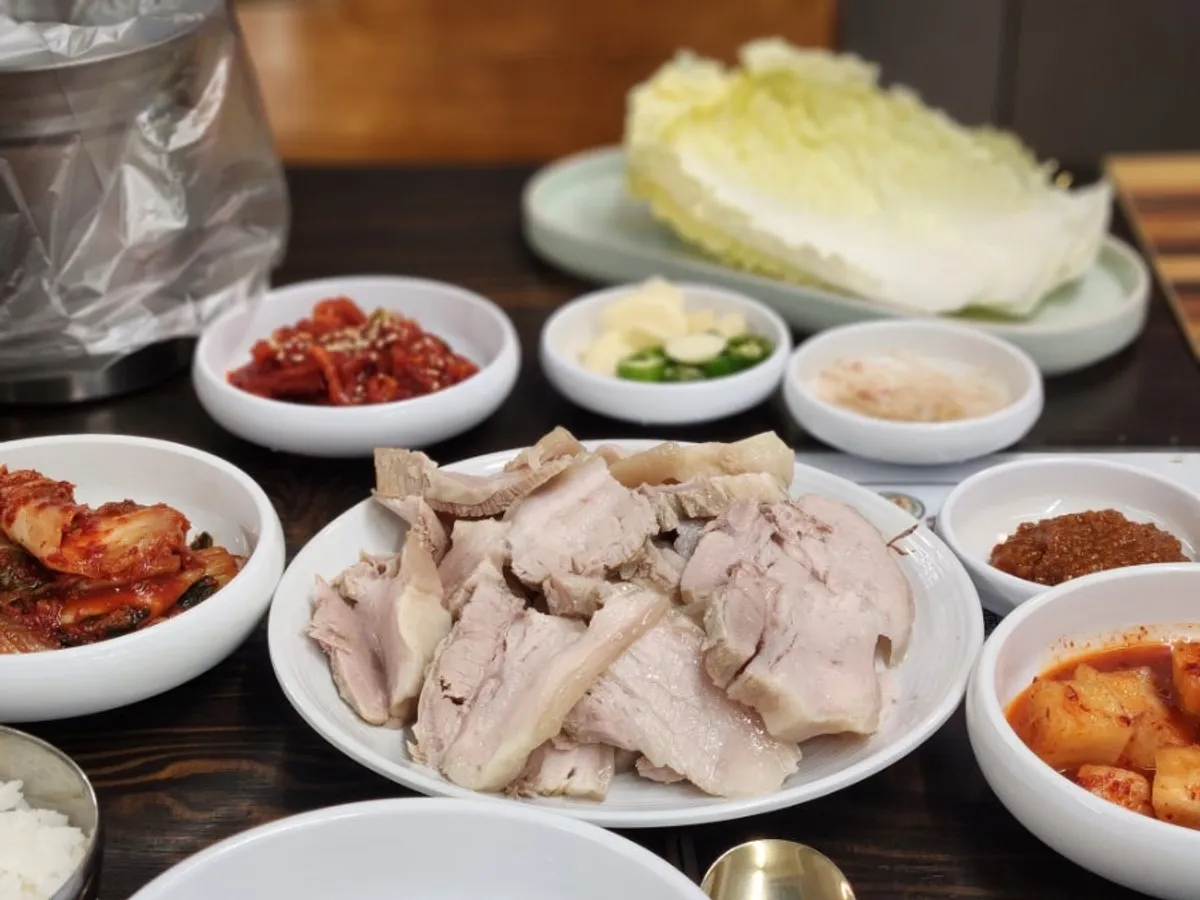 Table set with bossam medium and side dishes