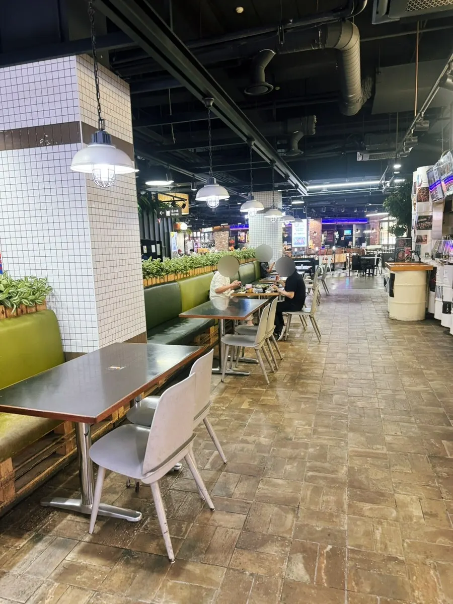 View of Taste Village with outdoor terrace seating