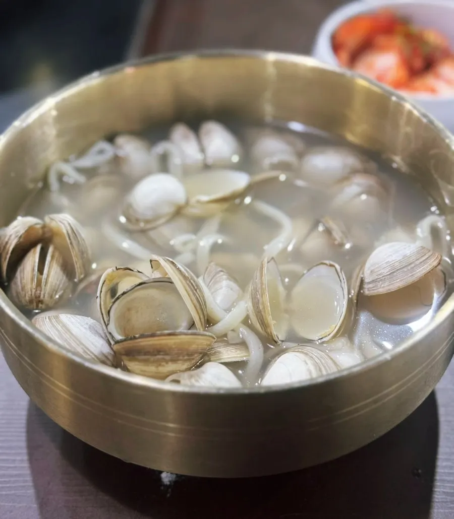Kalguksu noodles lifted up with chopsticks