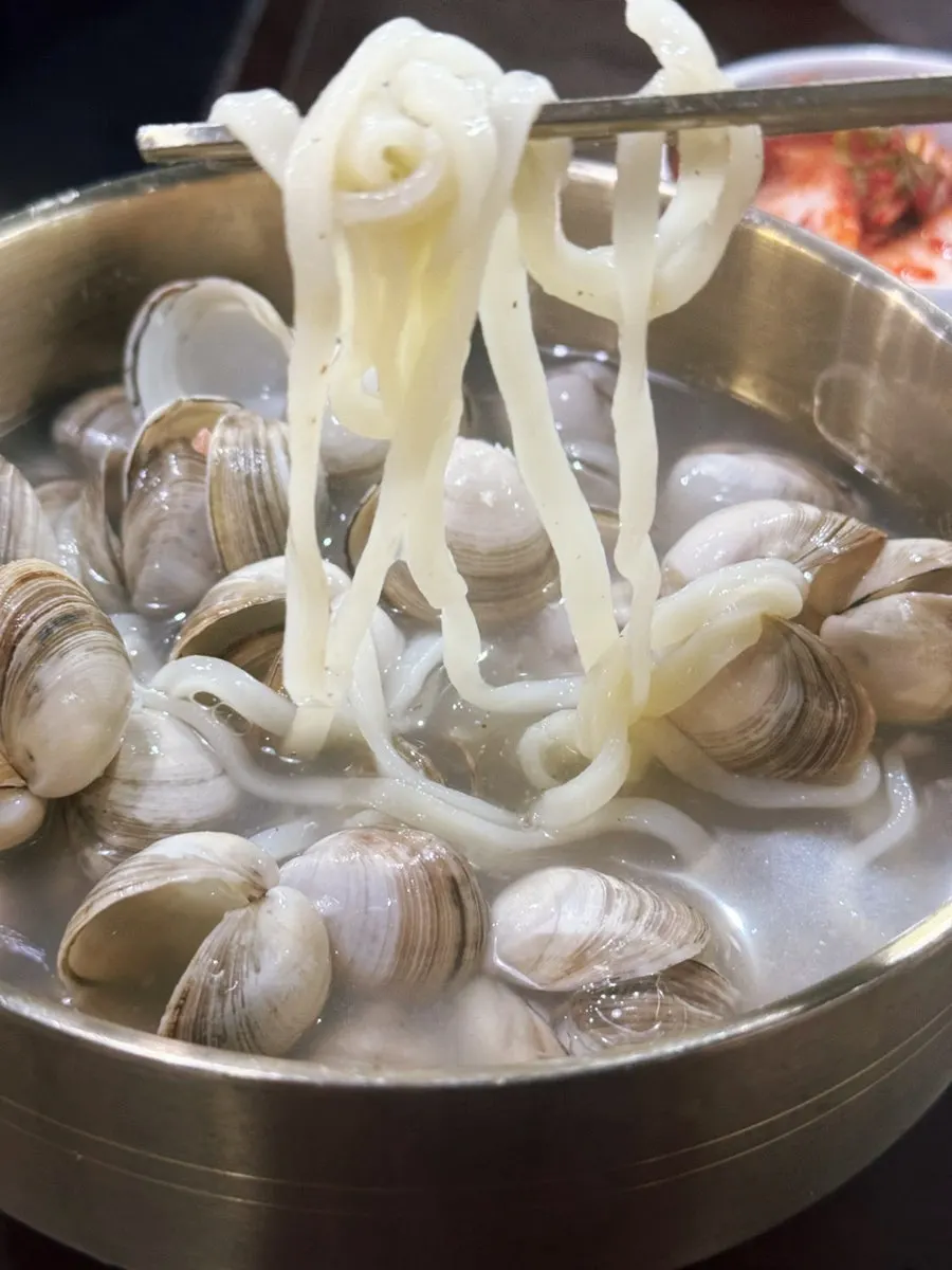 Clam kalguksu bowl shared with the kids