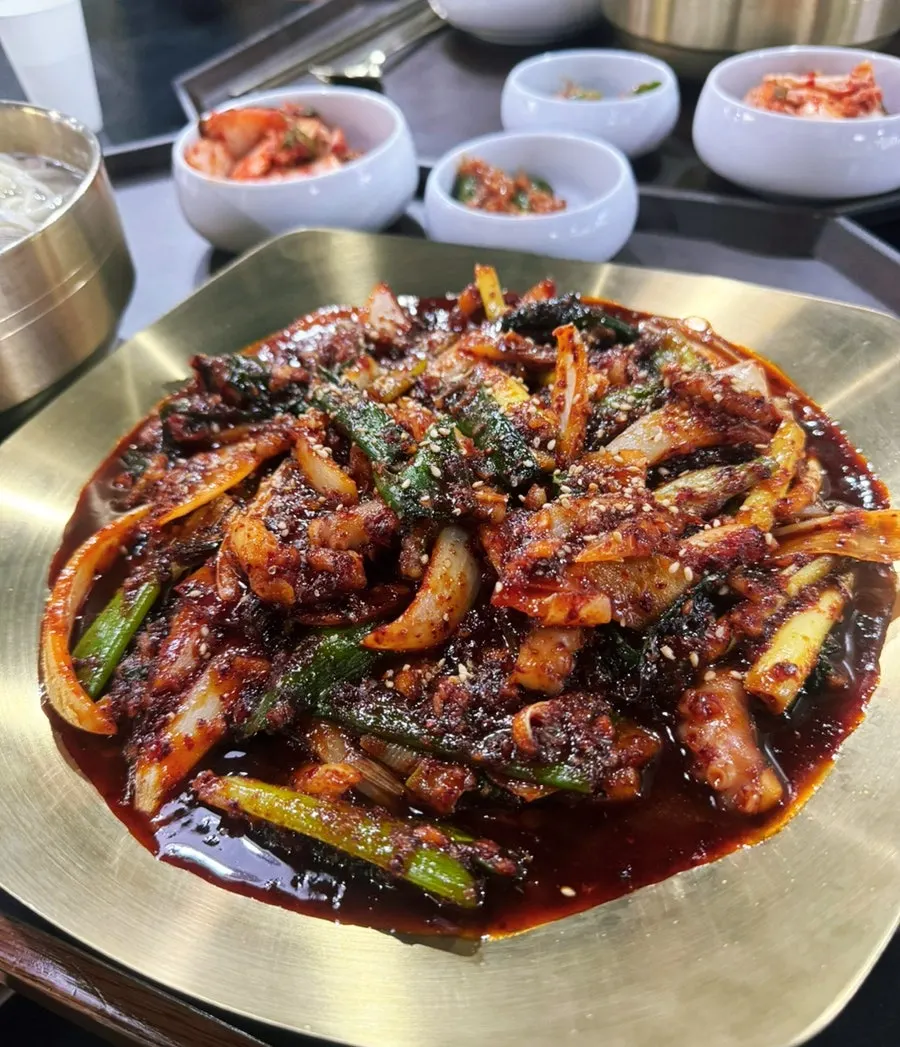 Close-up of octopus stir-fry well coated in sauce